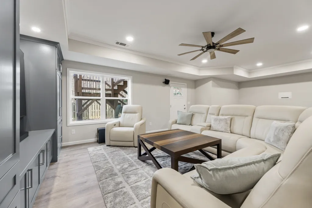 Finished basement living area in Cumming, GA by HomeVantage