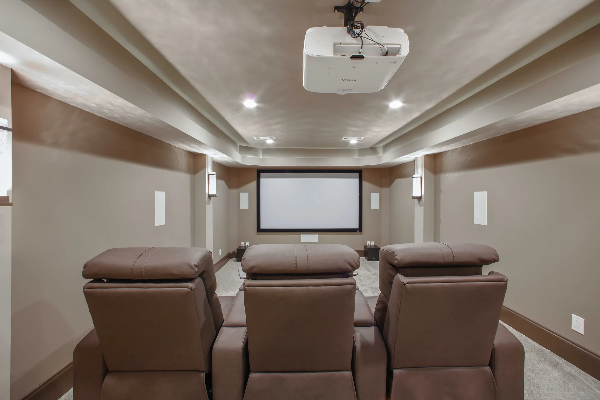 Home theater in a finished basement in Roswell, GA by HomeVantage
