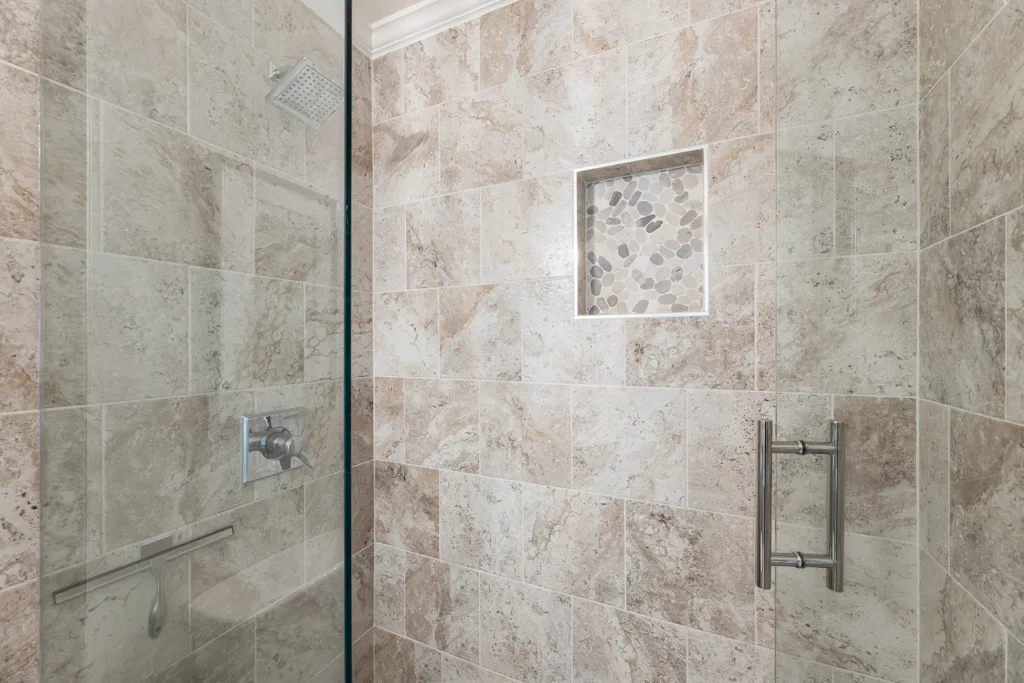 Walk-in shower, Custom tilework — Cumming bathroom remodel by HomeVantage
