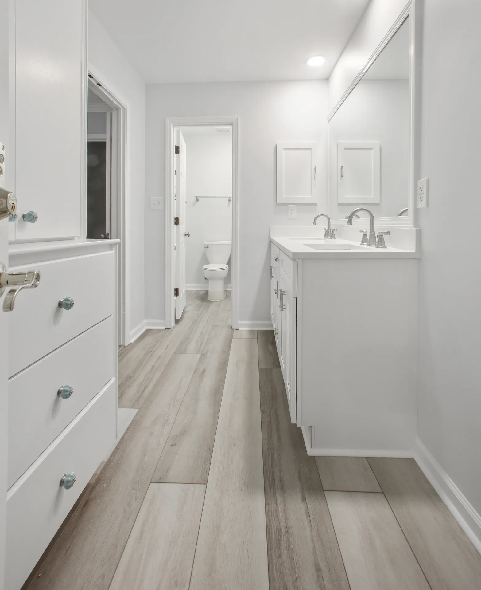 Glass shower and vanity in a Sugar Hill, GA bathroom remodel by HomeVantage