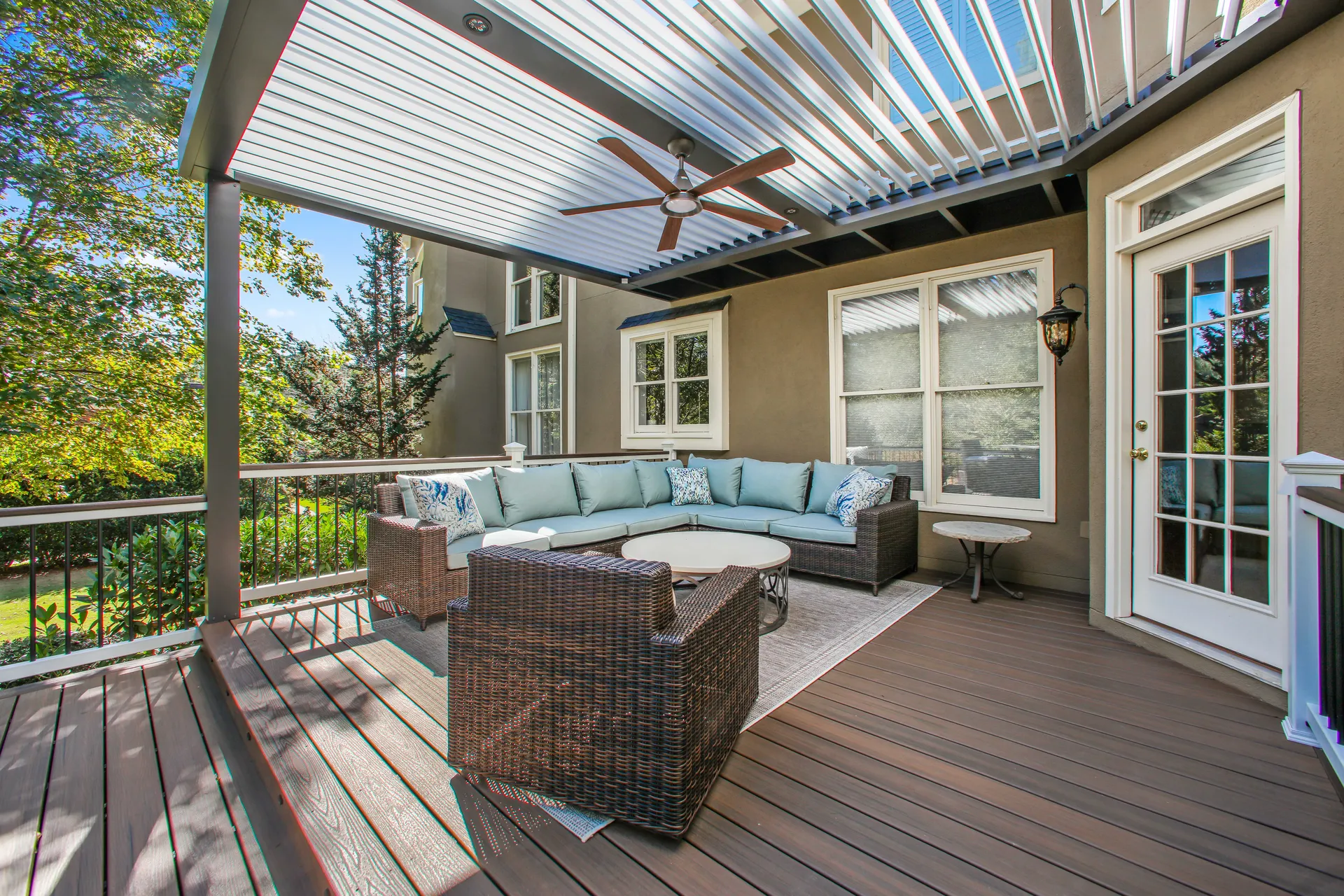 Louvered-roof covered deck living area on a composite deck in Alpharetta, GA by HomeVantage