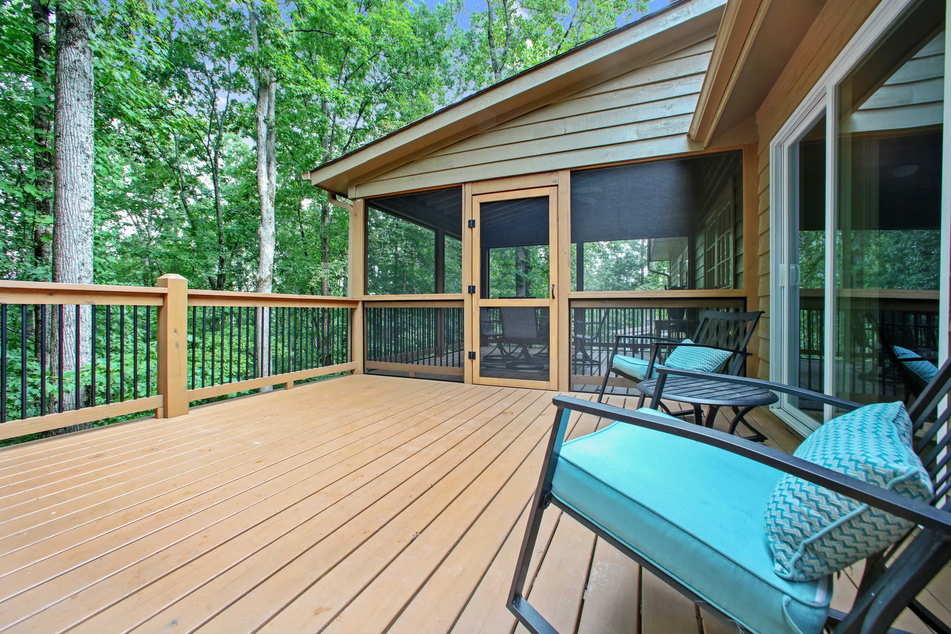 Covered deck with outdoor seating among the trees in Roswell, GA, built by HomeVantage