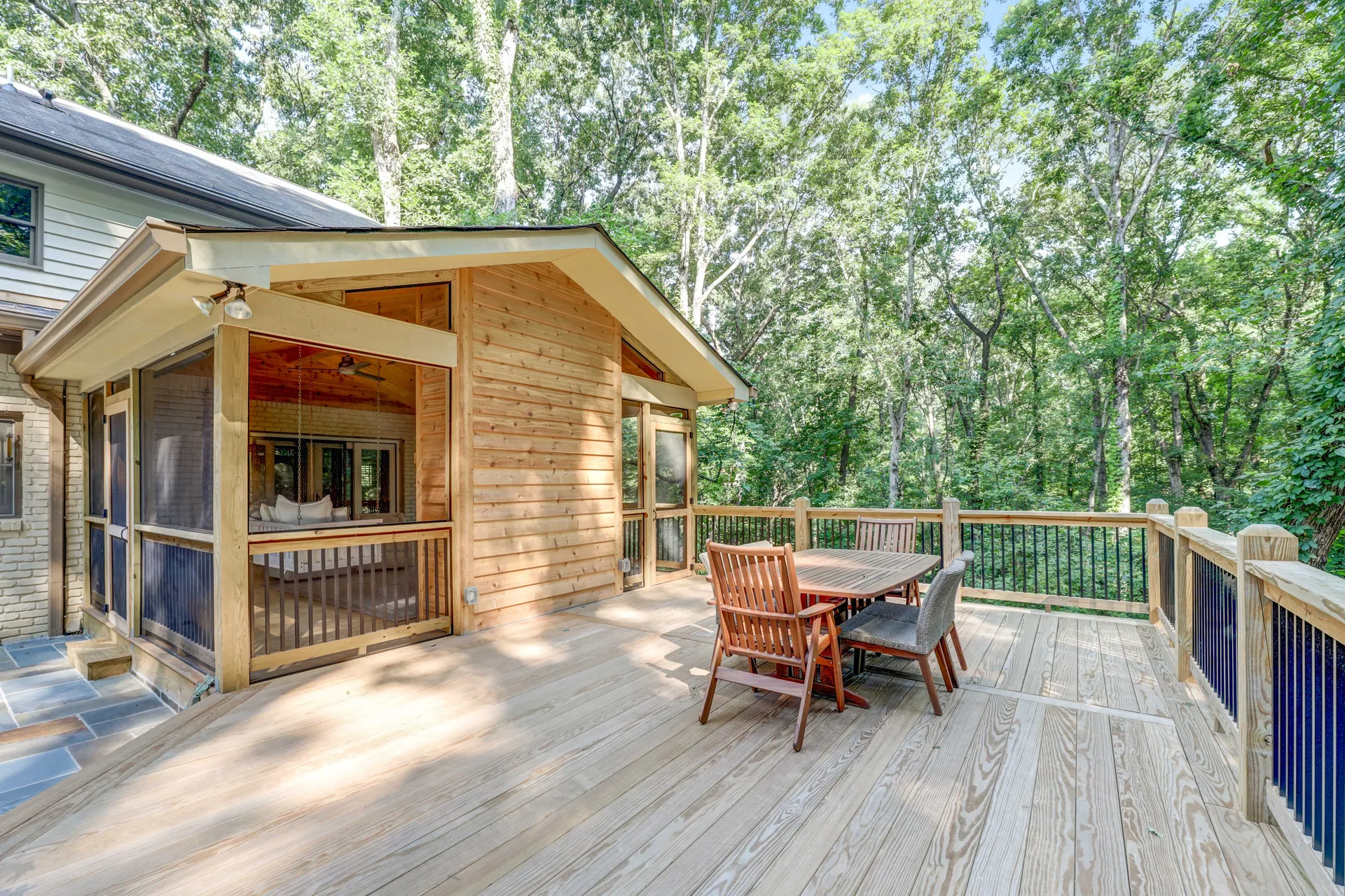 Covered deck on a wooded lot in Sandy Springs, GA by HomeVantage