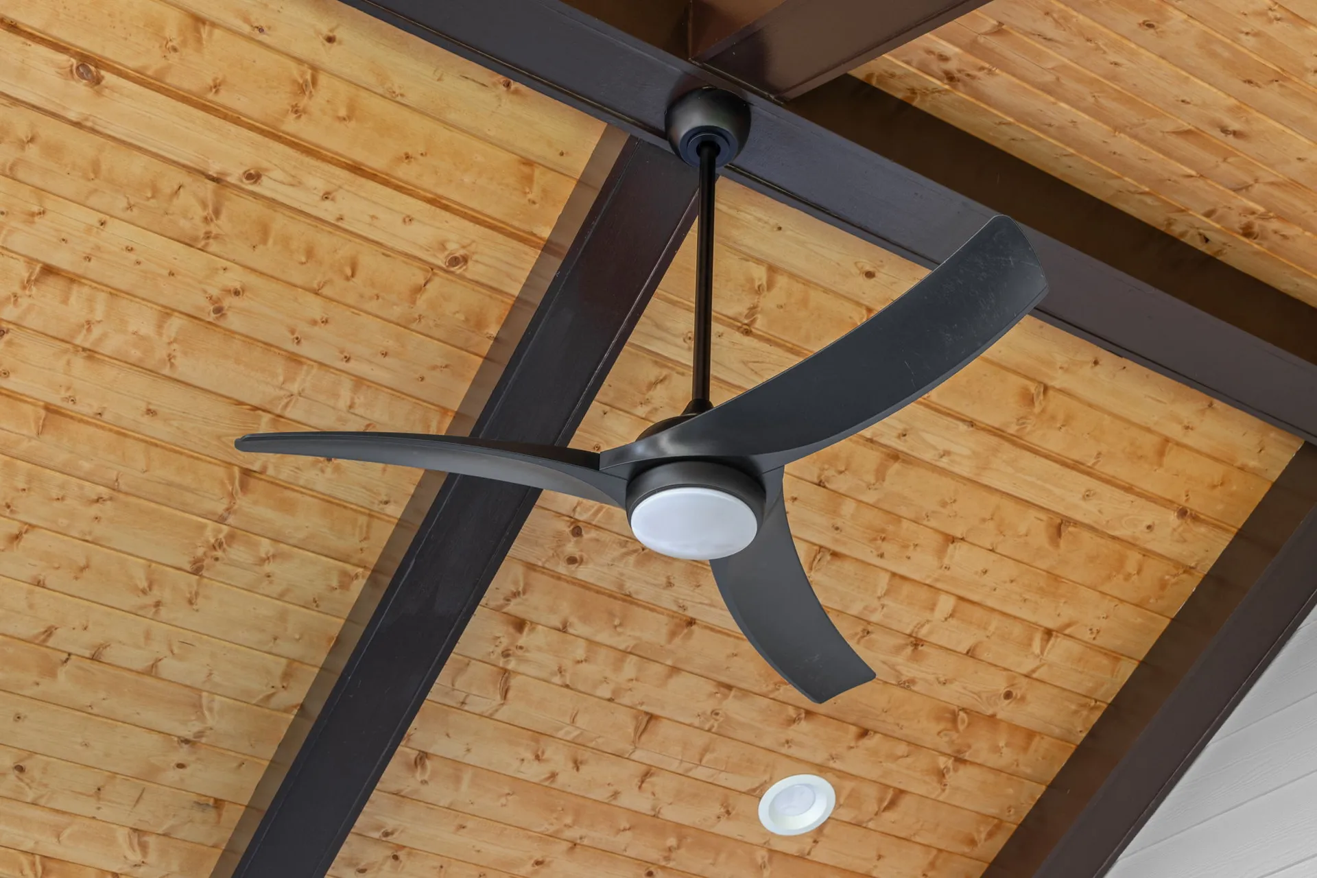Covered patio with a vaulted wood ceiling in Cumming, GA by HomeVantage
