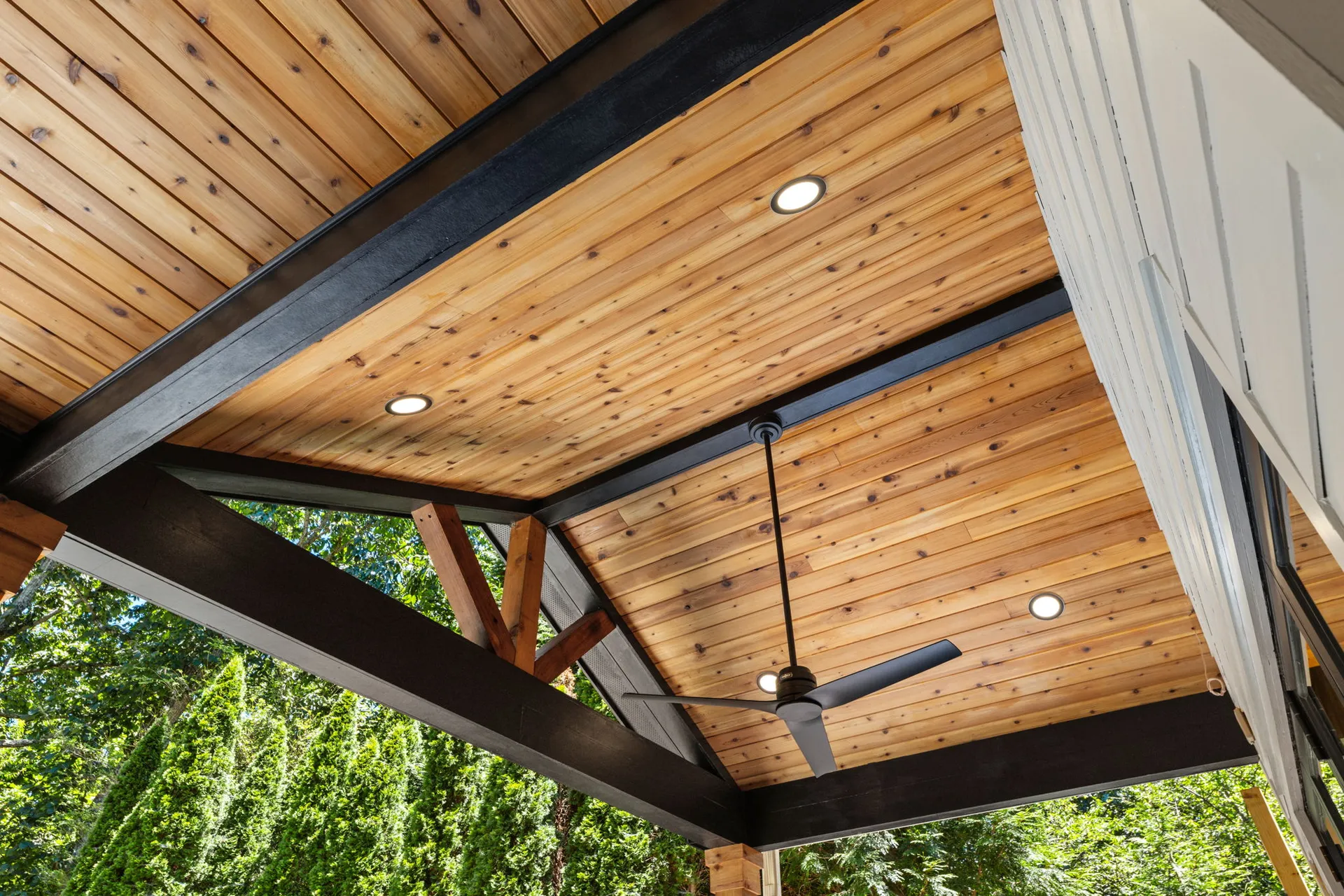 Covered patio with a vaulted wood ceiling in Cumming, GA by HomeVantage