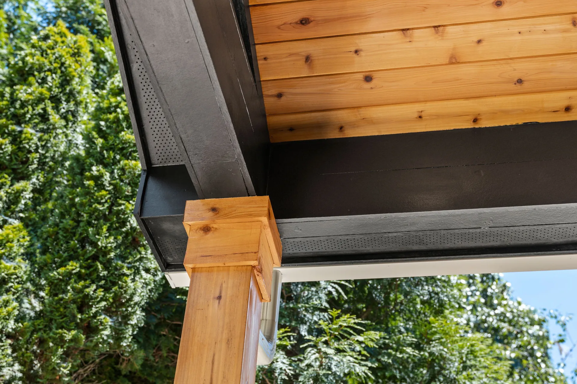 Covered patio with a vaulted wood ceiling in Cumming, GA by HomeVantage