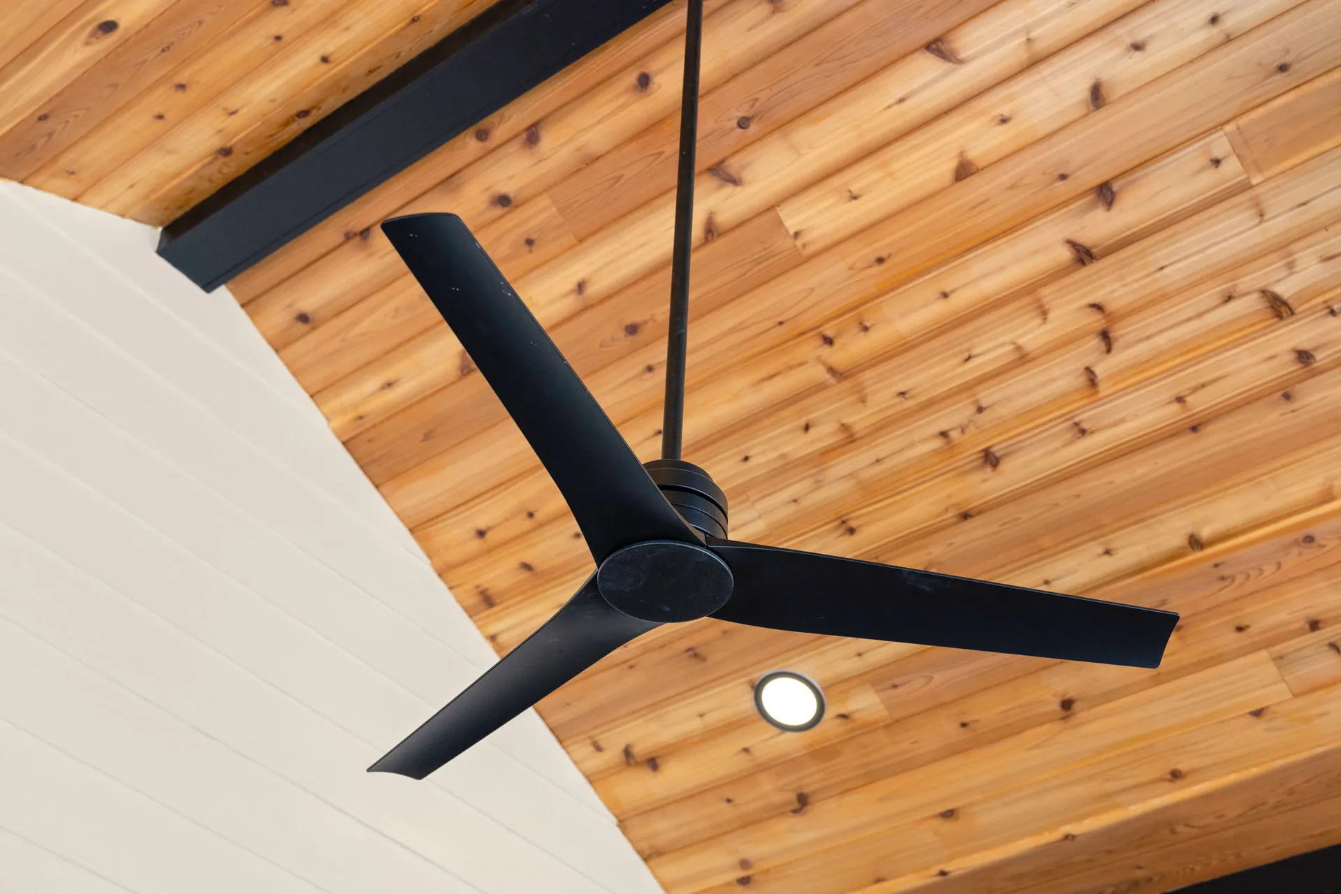 Covered patio with a vaulted wood ceiling in Cumming, GA by HomeVantage
