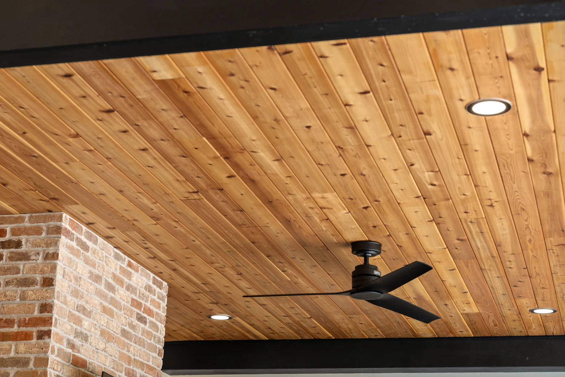 Covered patio with a vaulted wood ceiling in Cumming, GA by HomeVantage