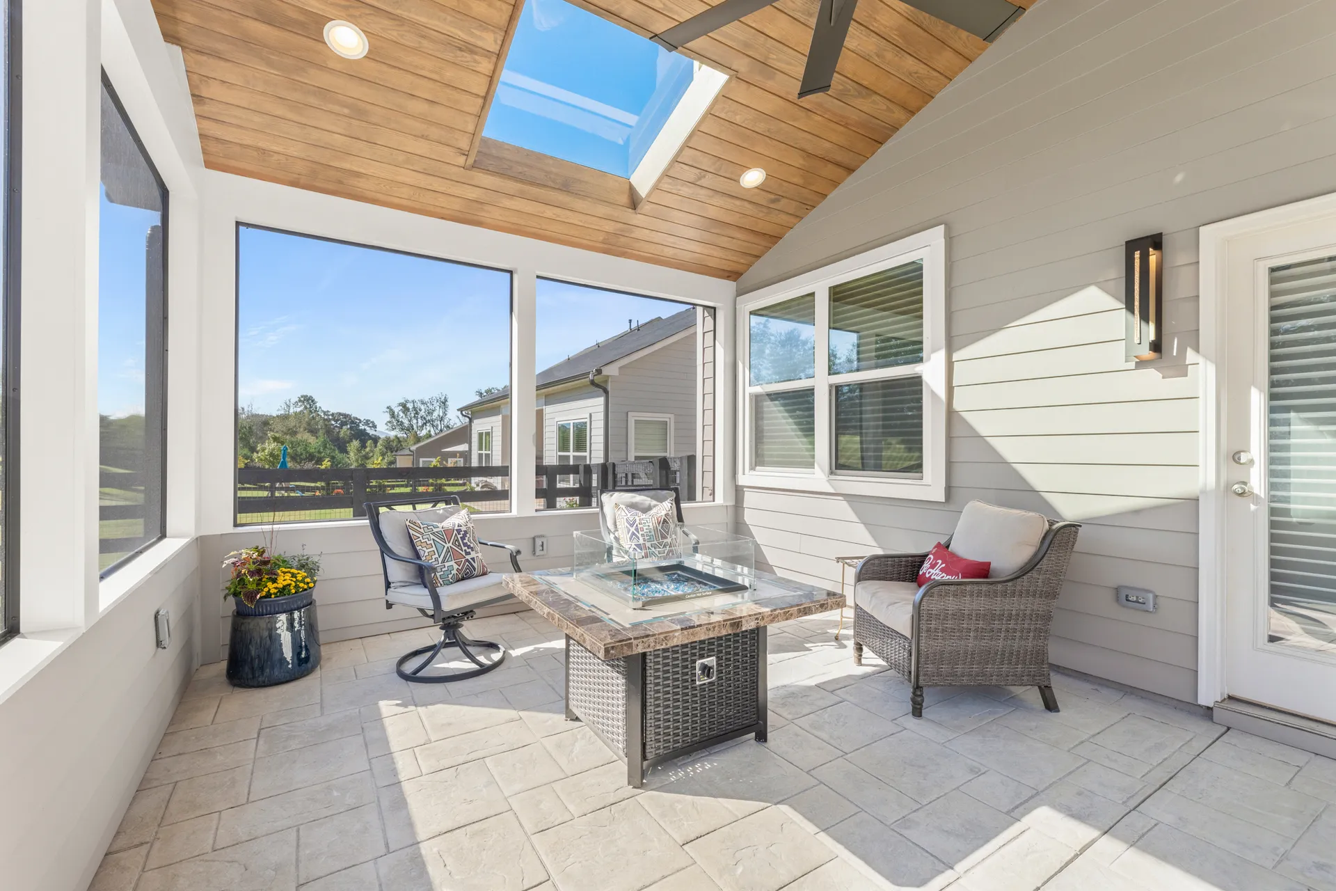 Covered patio with a vaulted wood ceiling in Cumming, GA by HomeVantage