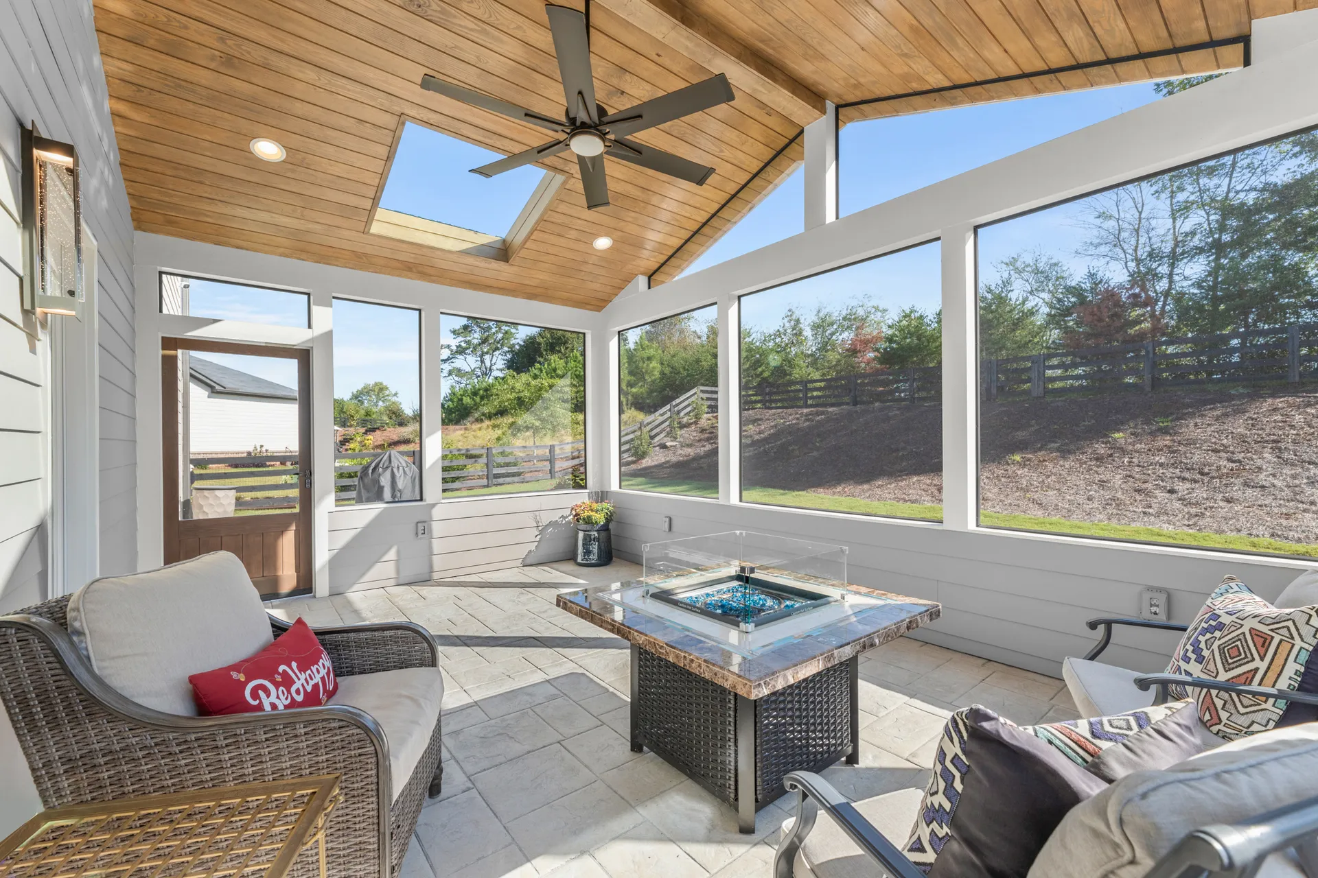Covered patio with a vaulted wood ceiling in Cumming, GA by HomeVantage
