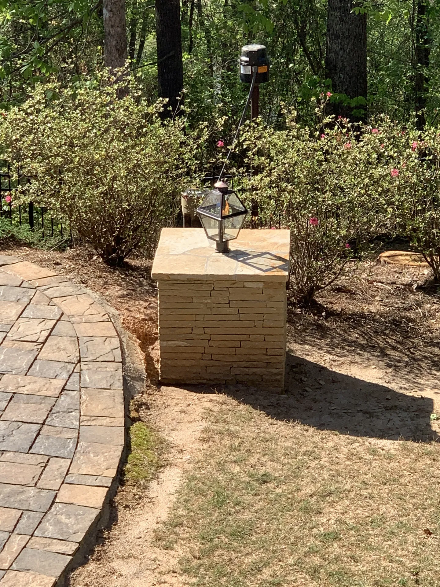 Covered patio with a fire pit in Roswell, GA by HomeVantage
