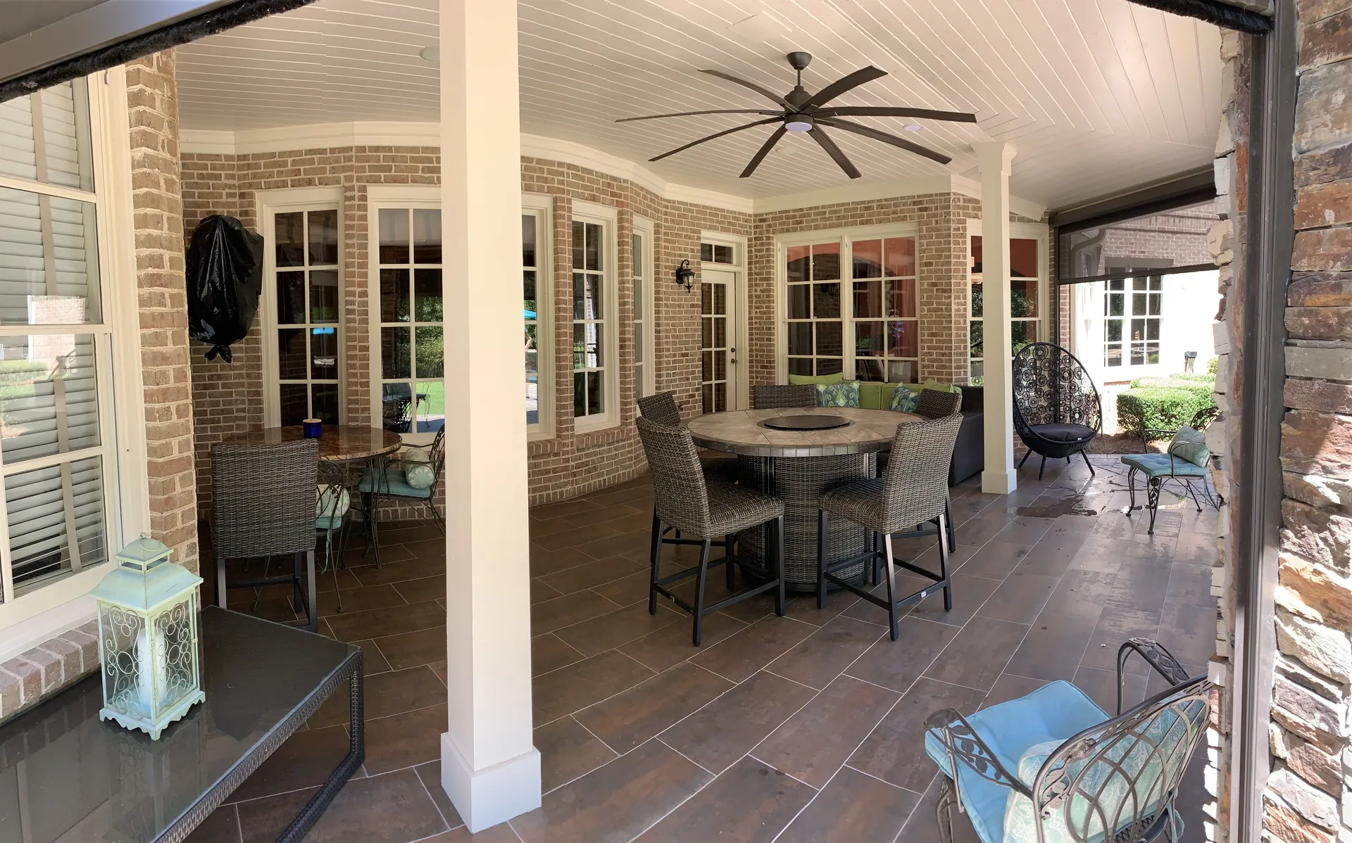 Covered patio with a vaulted wood ceiling in Roswell, GA by HomeVantage