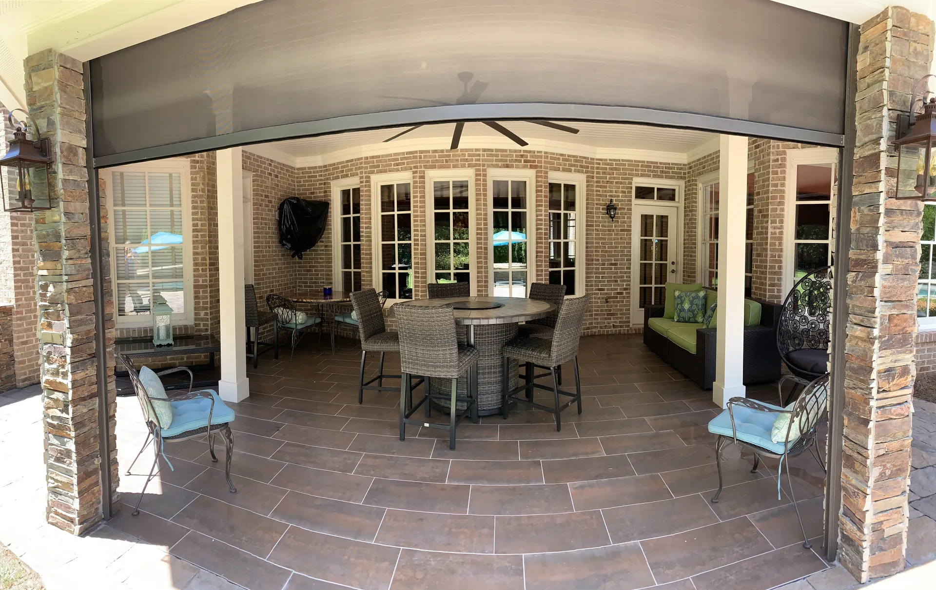Covered patio with a vaulted wood ceiling in Roswell, GA by HomeVantage