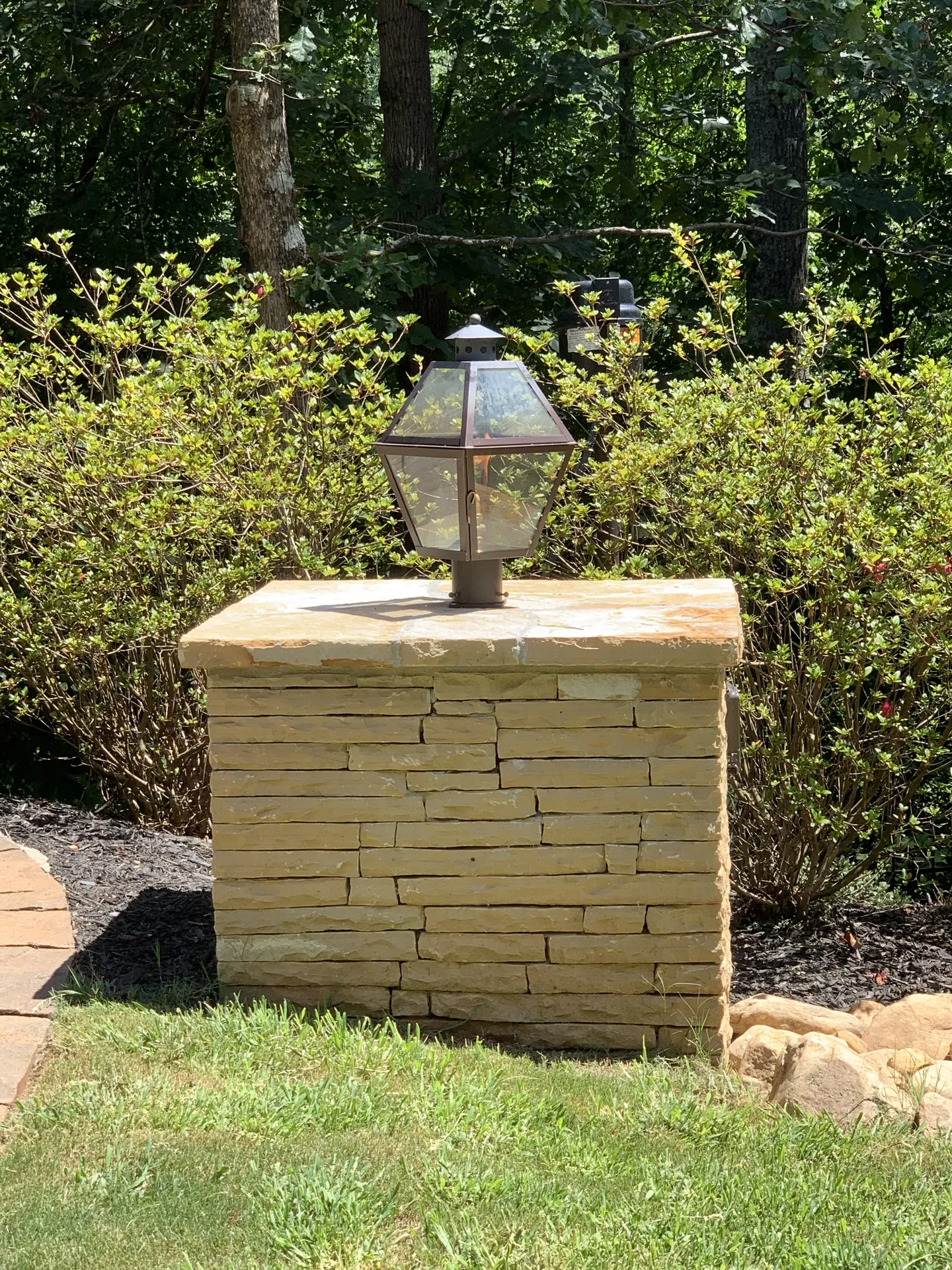 Covered patio with an outdoor kitchen in Roswell, GA by HomeVantage