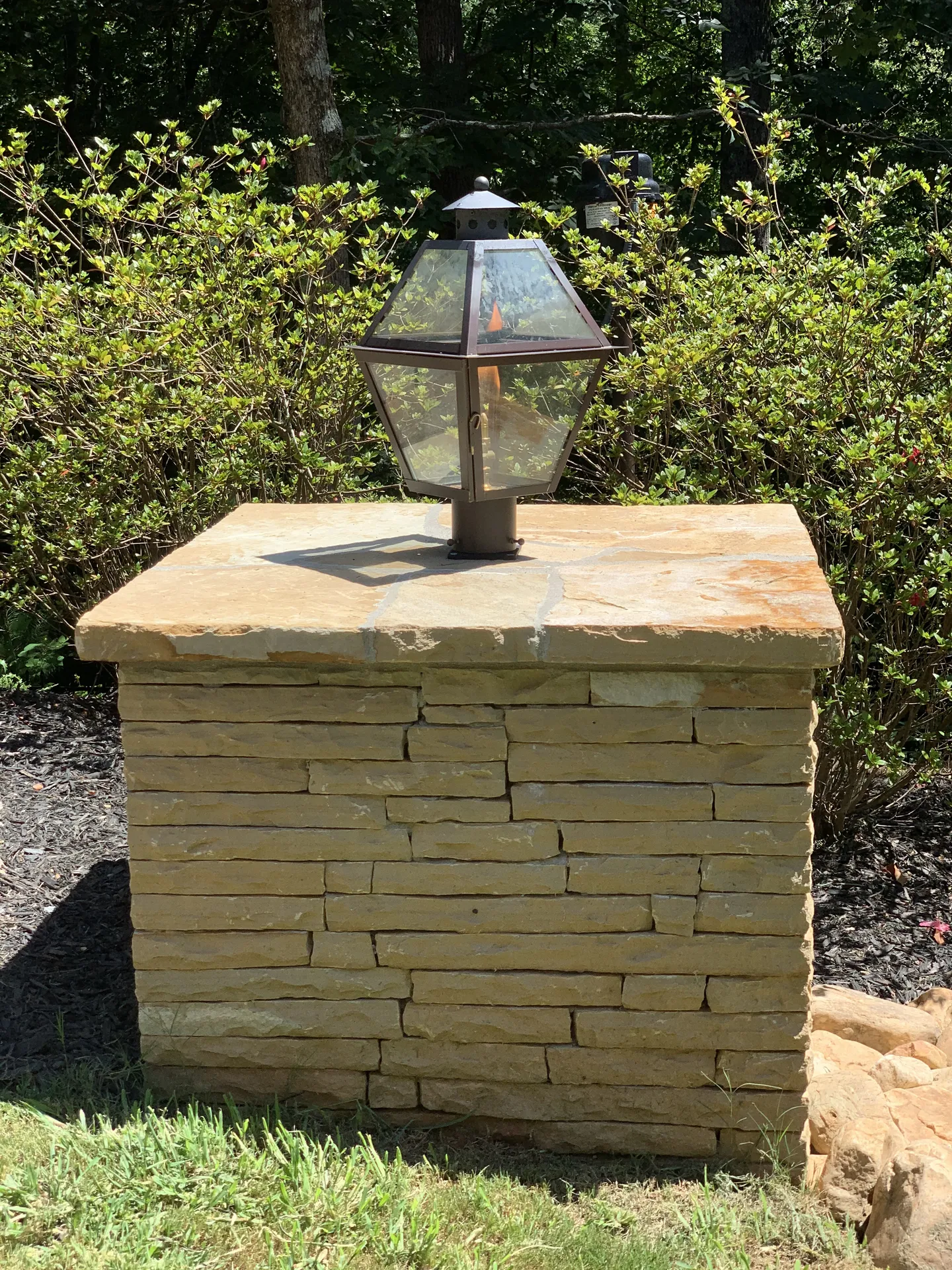 Covered patio with an outdoor kitchen in Roswell, GA by HomeVantage