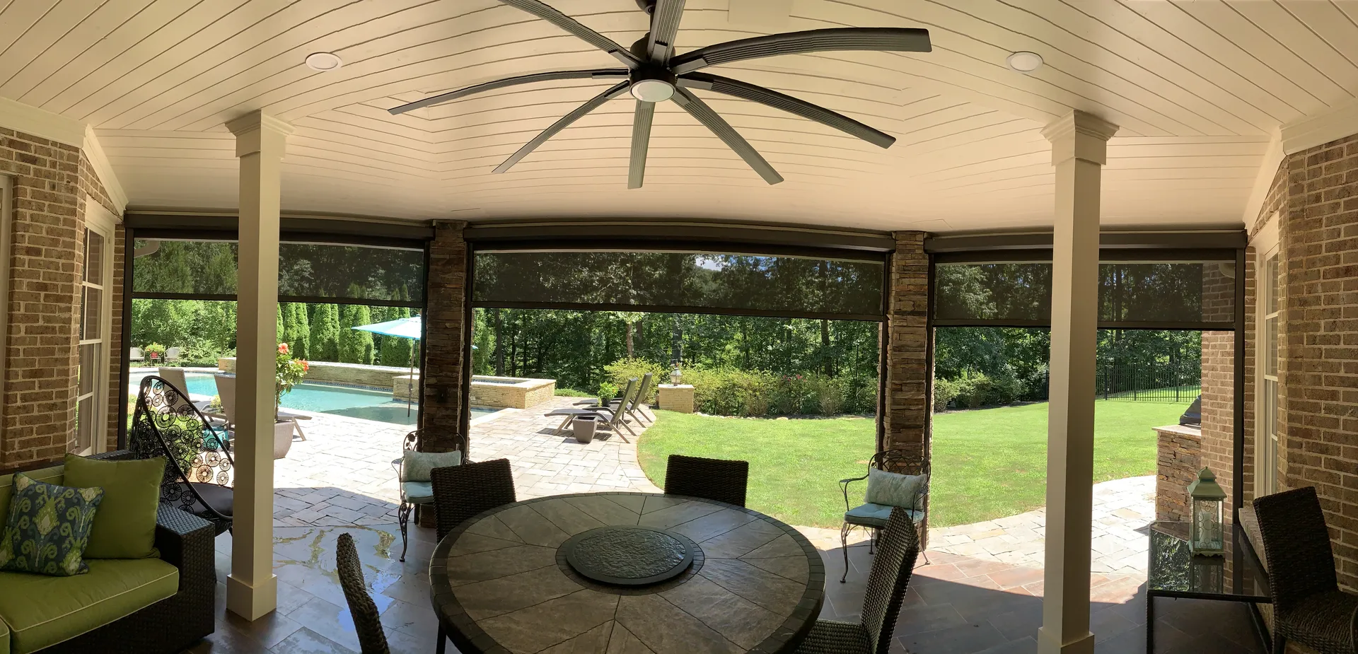 Covered patio with a vaulted wood ceiling in Roswell, GA by HomeVantage