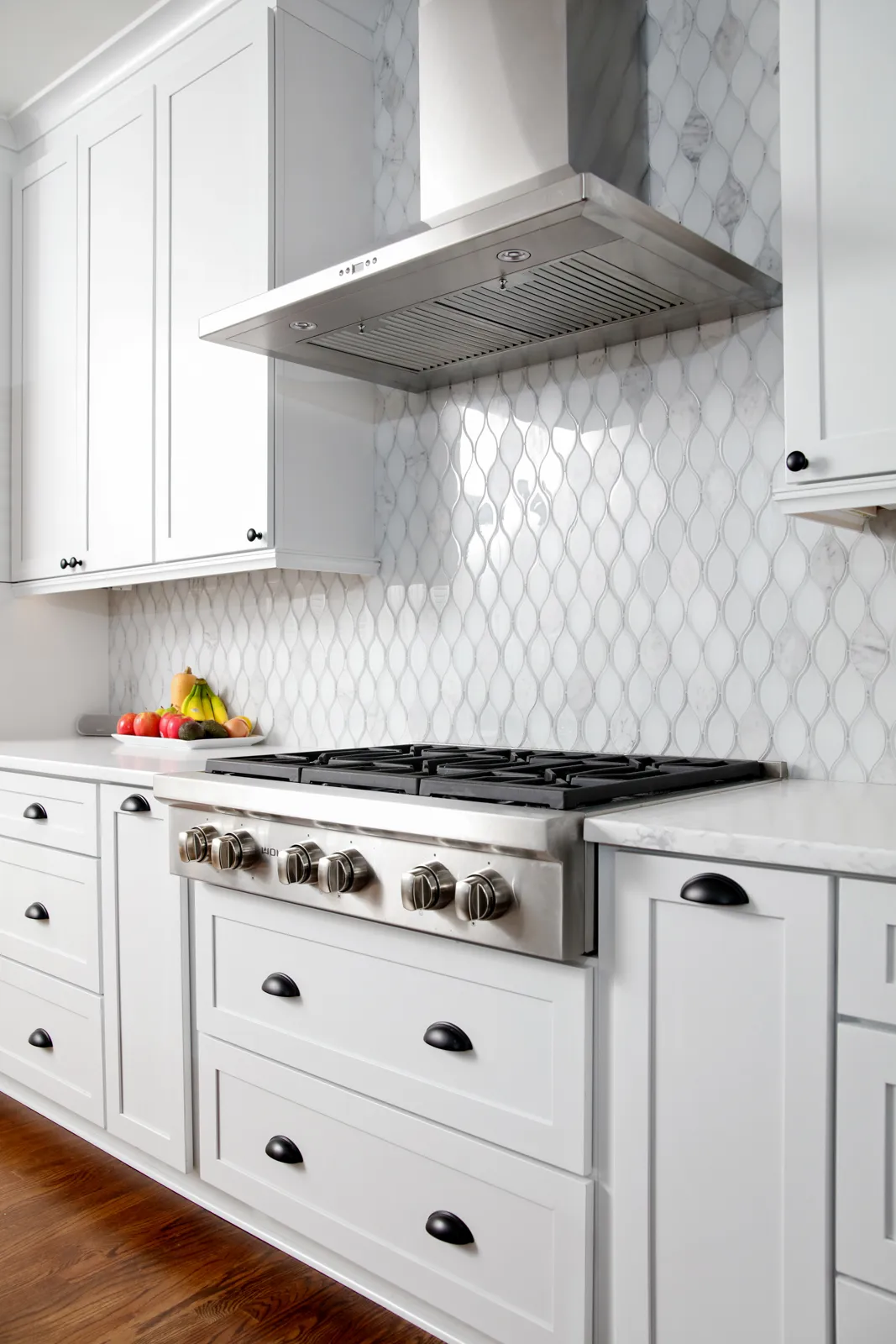 Range hood, Tile backsplash — Alpharetta kitchen remodel by HomeVantage