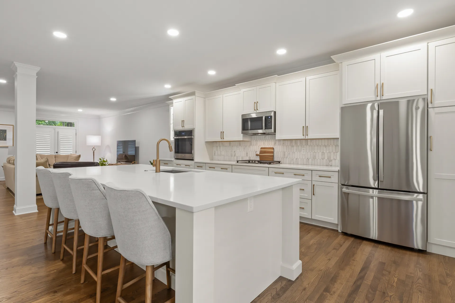 Remodeled kitchen with large island and seating in Duluth, GA by HomeVantage