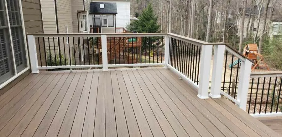 Composite deck stairs and white railing detail on a Milton, GA deck by HomeVantage