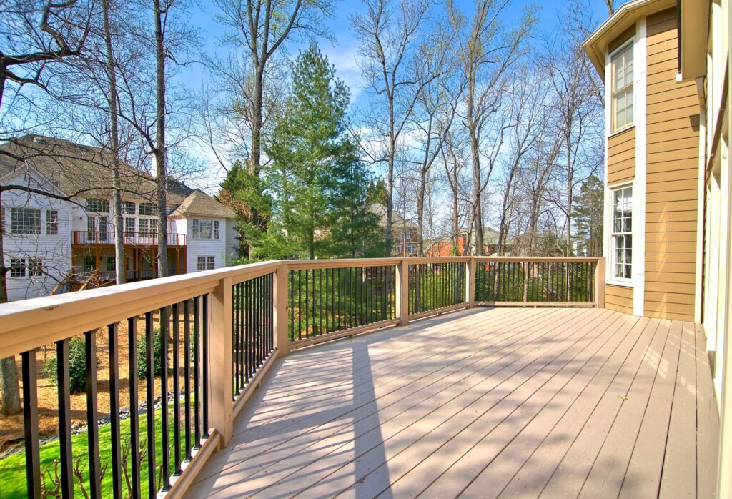 Outdoor deck view showcasing modern design and integration with surrounding nature in a residential area of Cumming, GA.